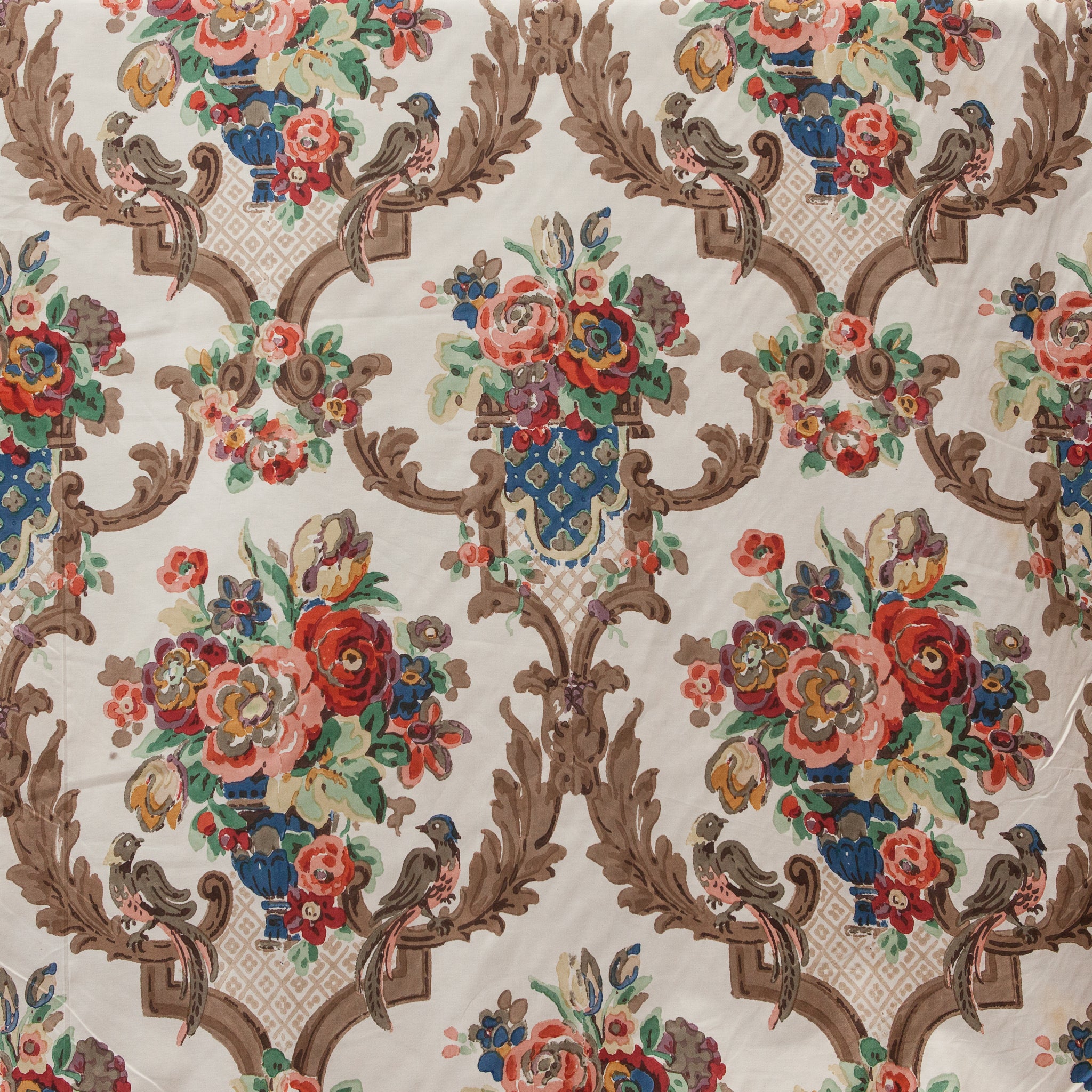 Decorative fabric with floral and bird pattern on a beige background