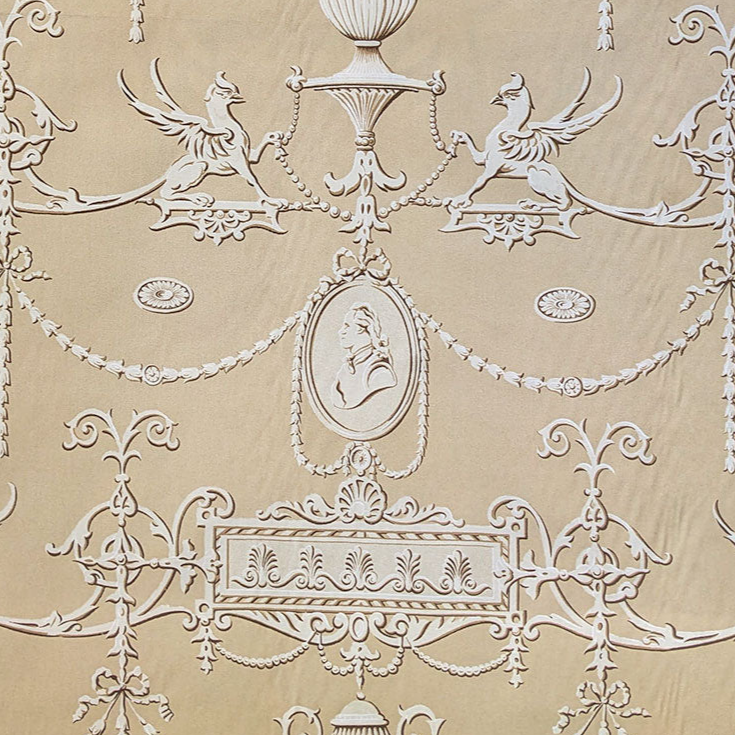 Decorative fabric with intricate white patterns on a beige background