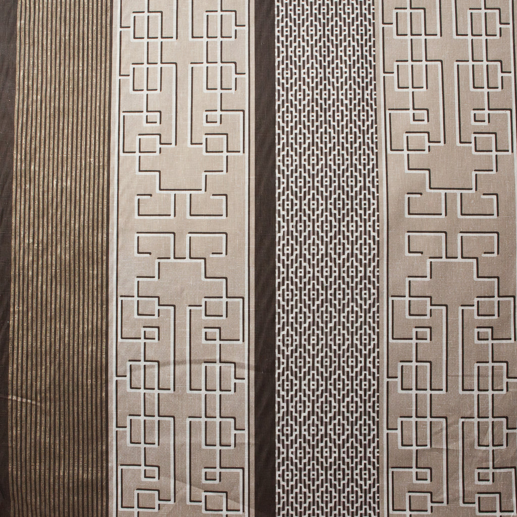 Decorative fabric panels with geometric patterns on a wooden background