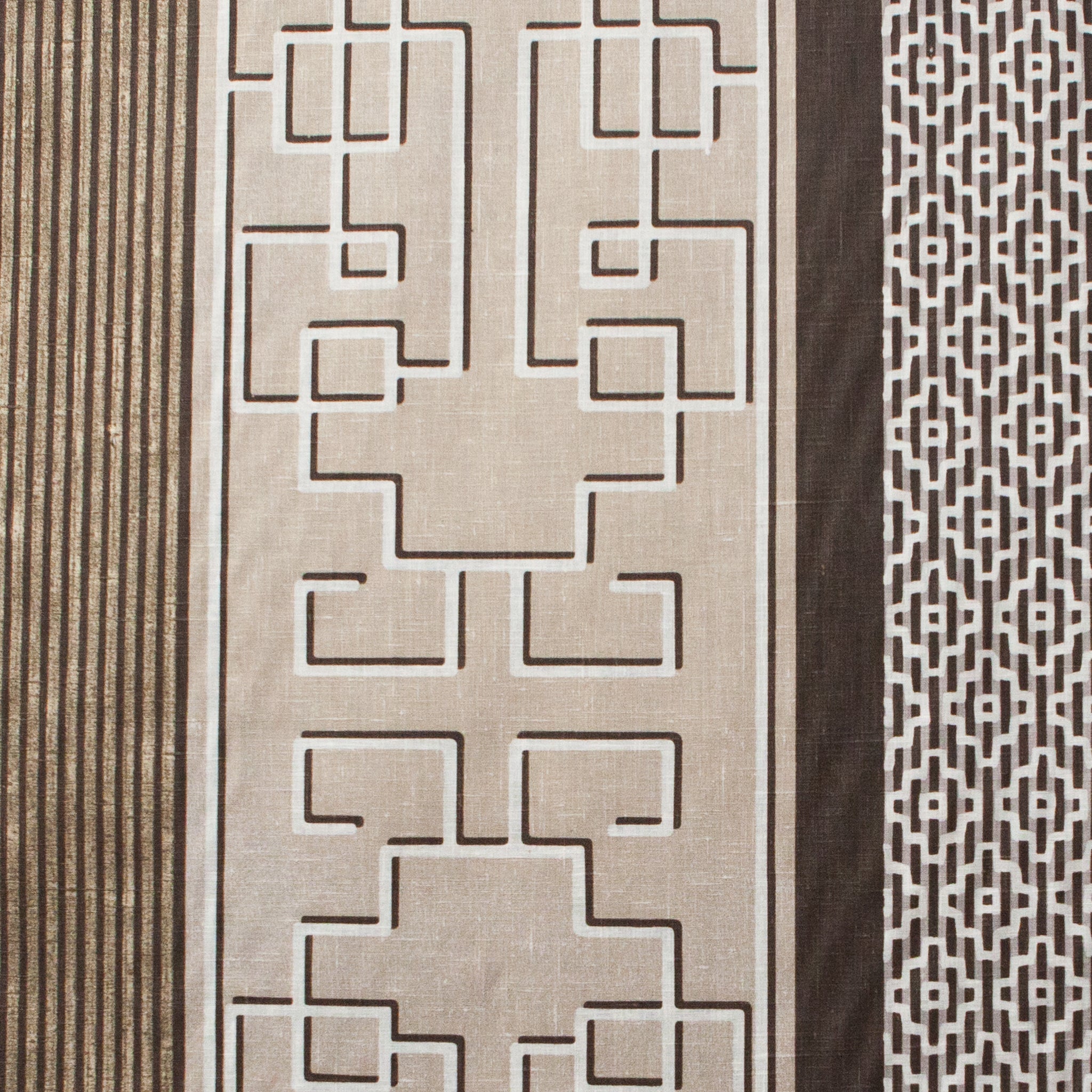 Textured fabric with geometric pattern and plain brown sections