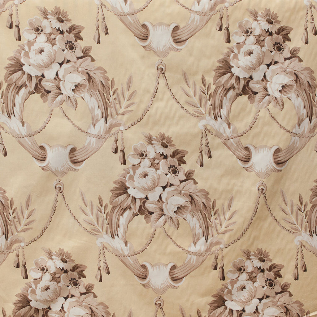 Decorative floral and ribbon pattern on a beige background