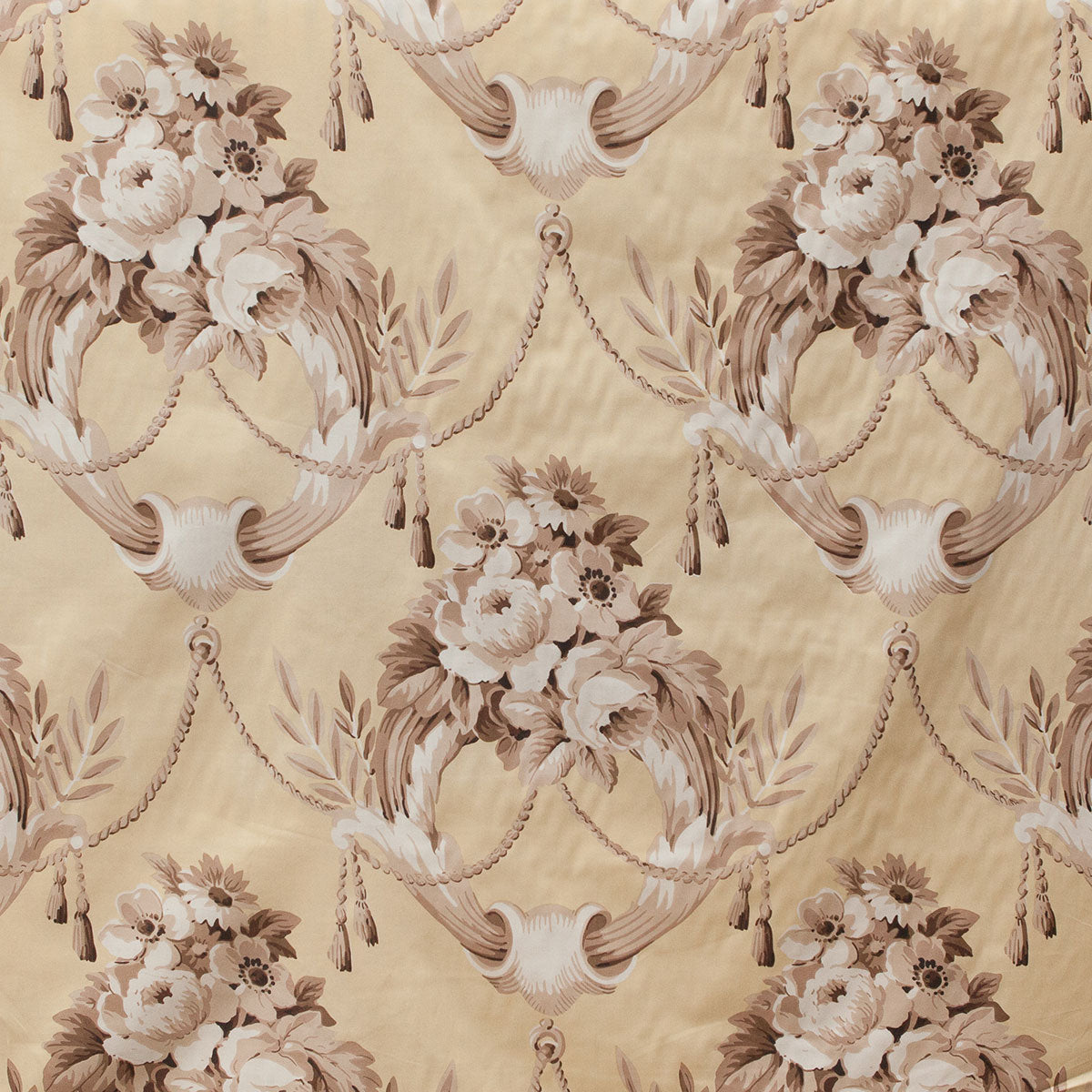Decorative floral and ribbon pattern on a beige background