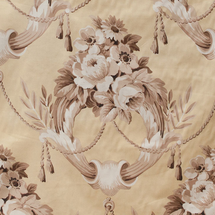 Decorative floral pattern with tassels on a beige background