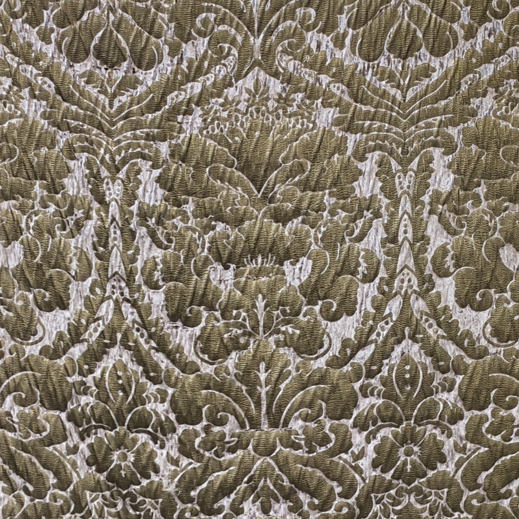 Close-up of a patterned fabric with intricate damask design