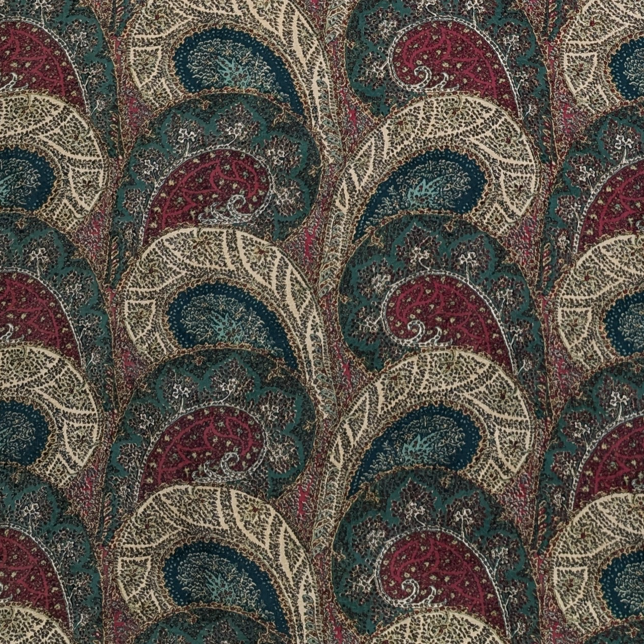 Paisley patterned fabric with a repeating design in red, blue, and beige.