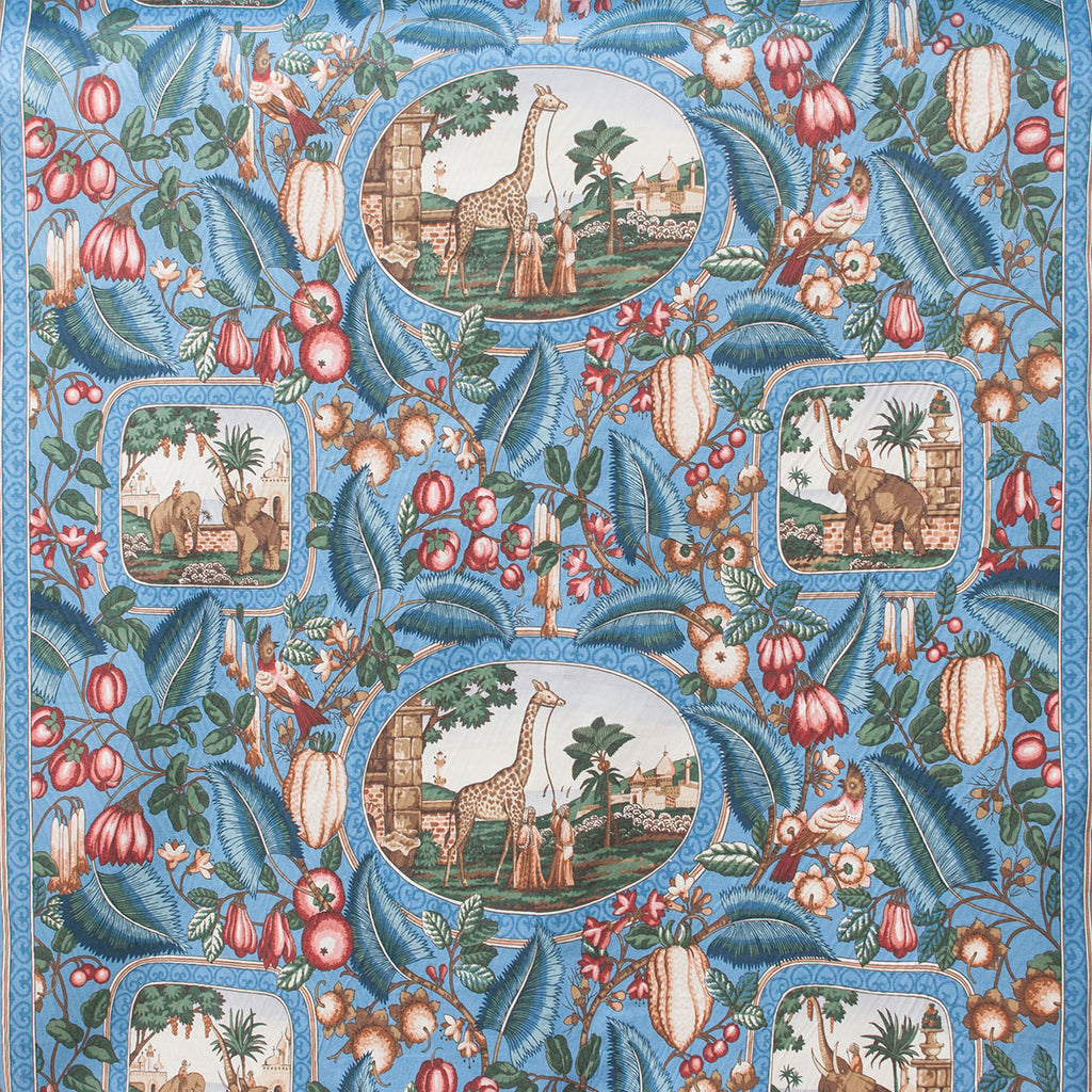 Decorative fabric pattern with animals, fruits, and leaves on a blue background