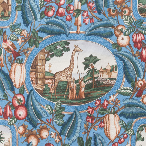 Decorative fabric pattern with animals, fruits, and leaves on a blue background