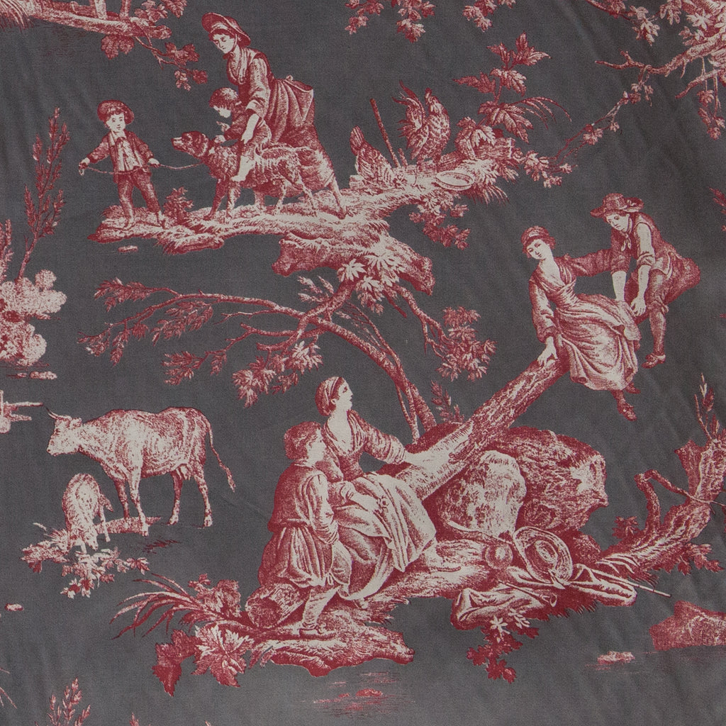 Vintage-style fabric with red and white pastoral scene pattern on a dark background