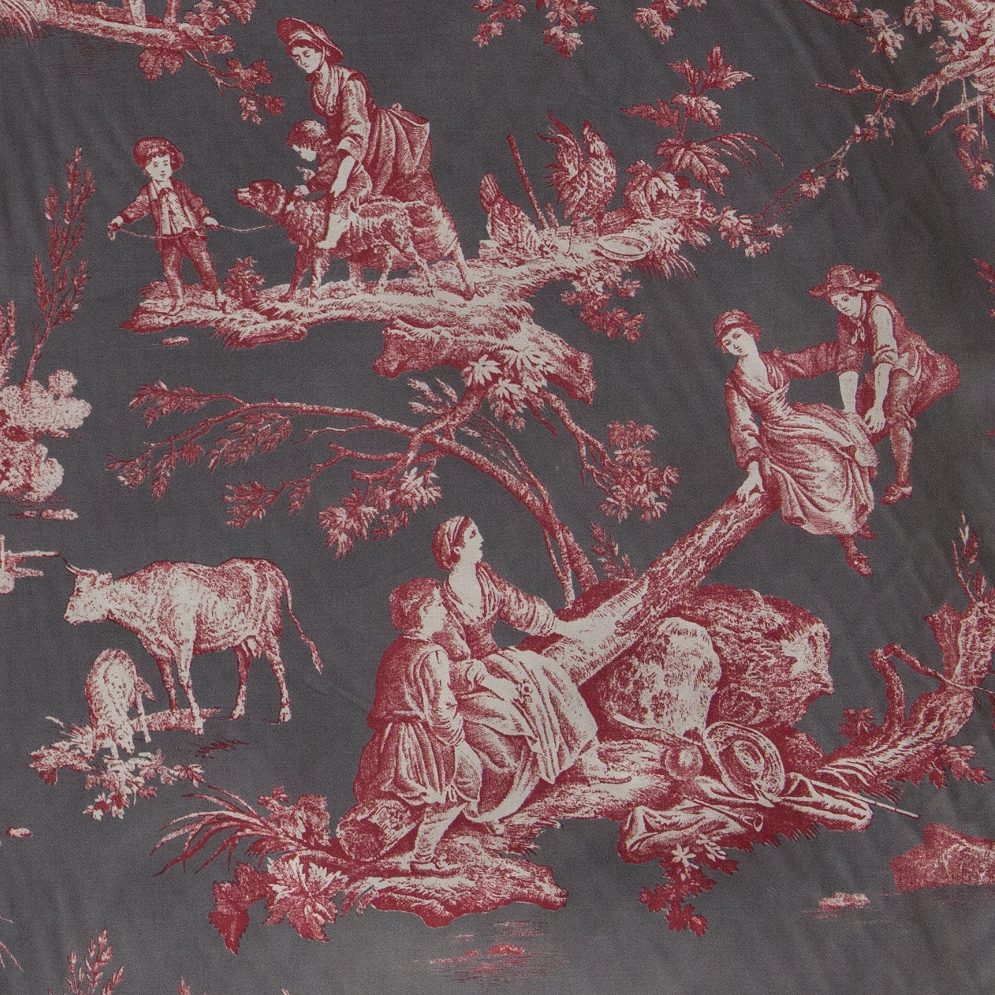 Vintage-style fabric with red and white pastoral scene pattern on a dark background