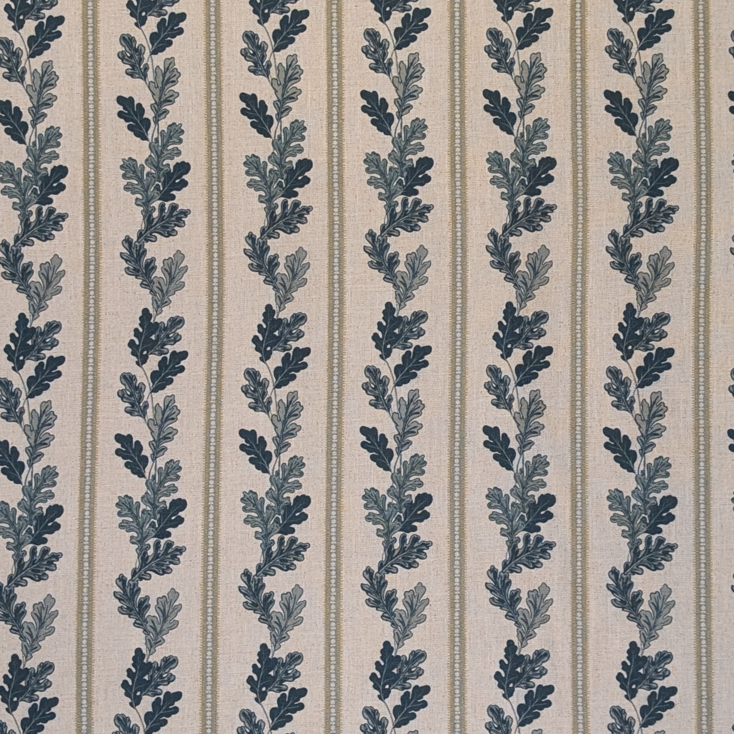 Striped linen fabric with blue oak leaves 