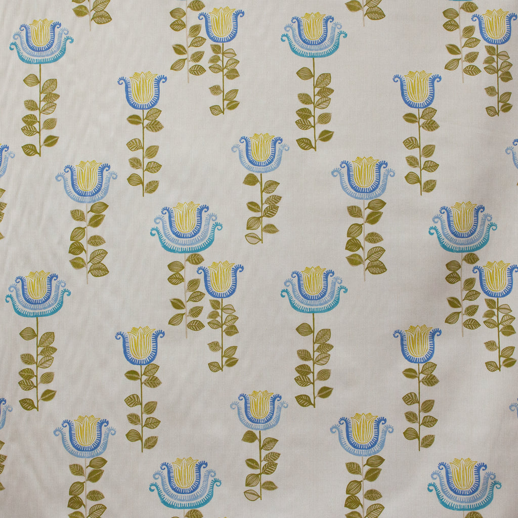 Patterned fabric with blue and yellow floral designs on a beige background