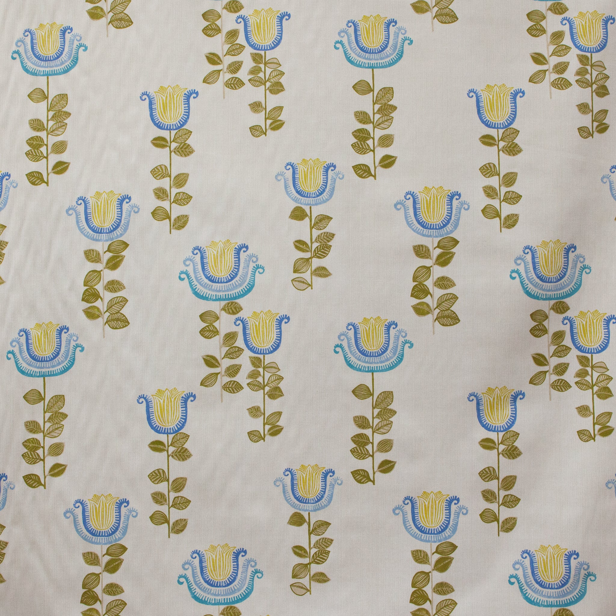 Patterned fabric with blue and yellow floral designs on a beige background