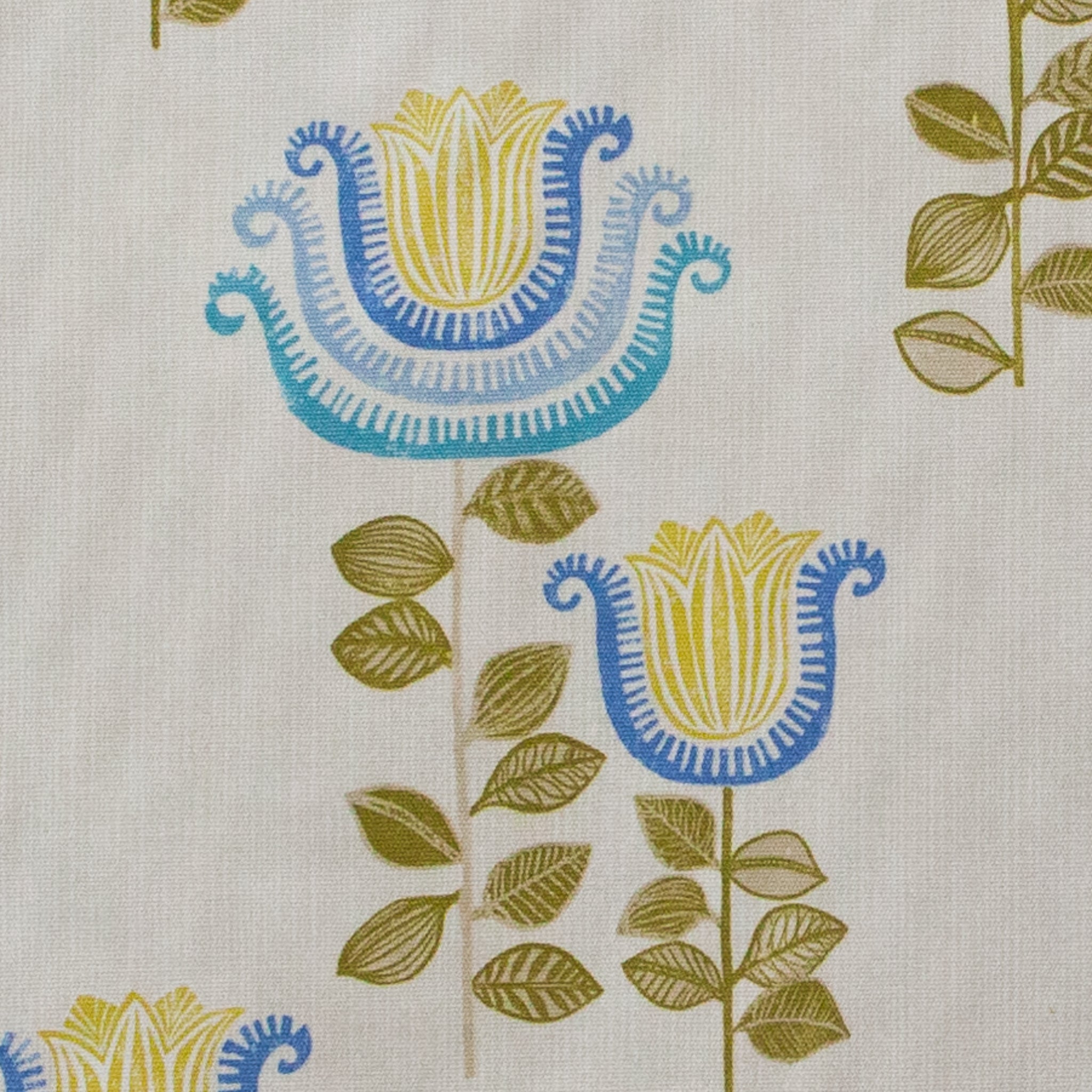 Fabric with blue and yellow floral pattern on a beige background