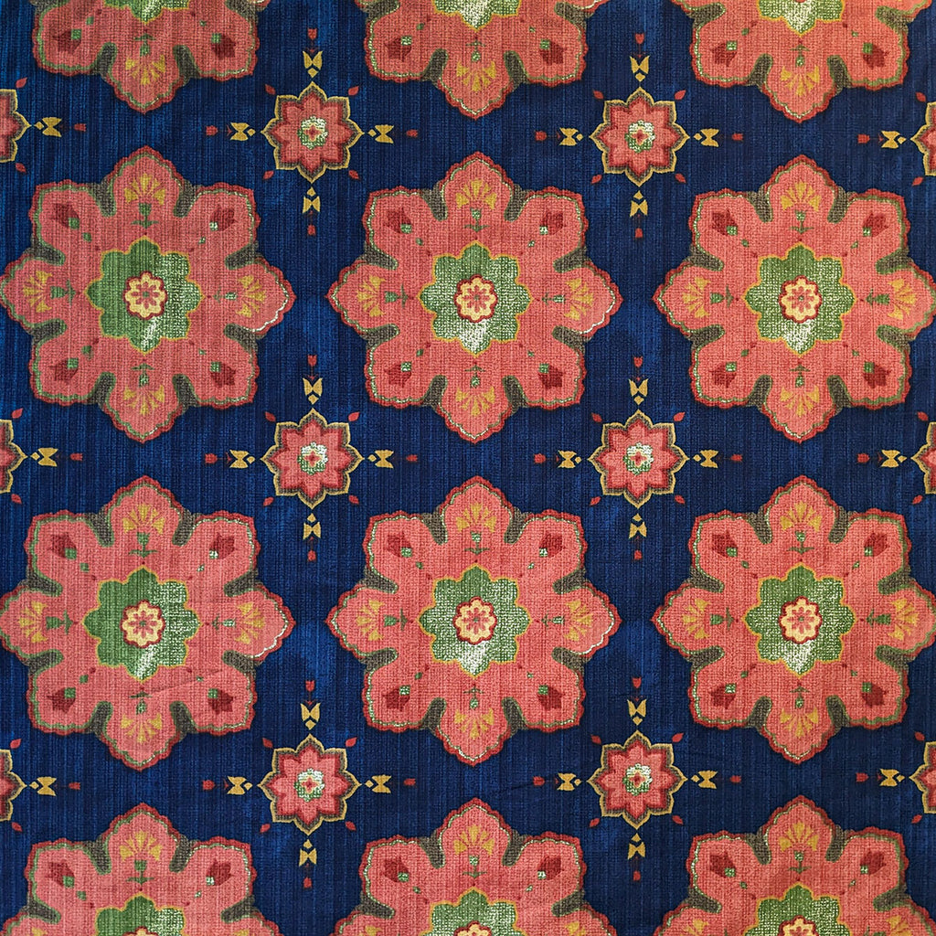 Patterned fabric with pink and green floral design on a blue background