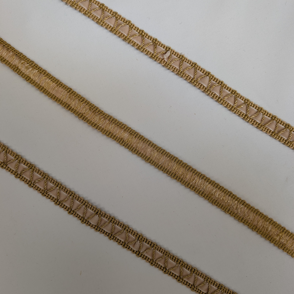 Two gold ribbons with a textured pattern on a white background