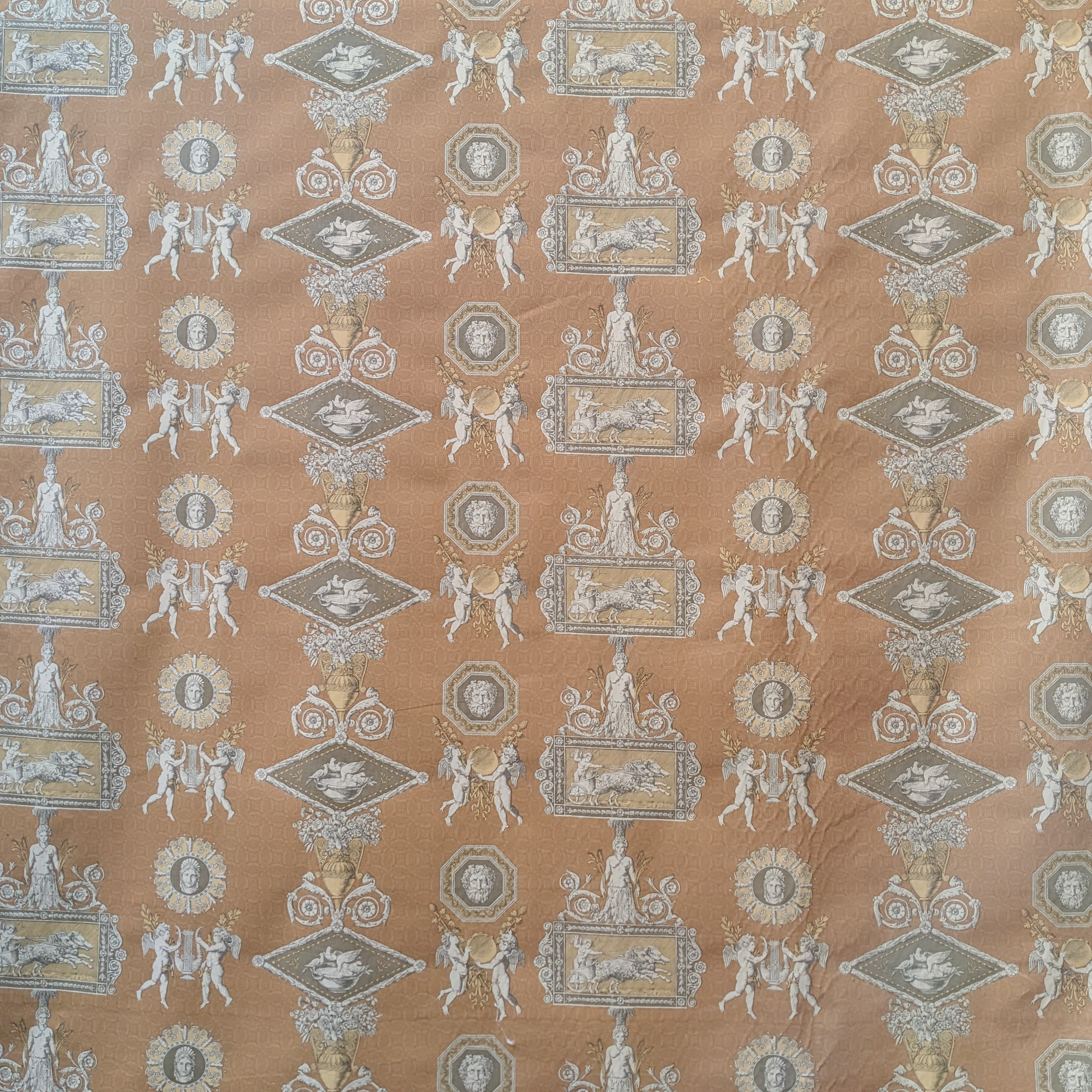 Decorative fabric with classical design on a brown background