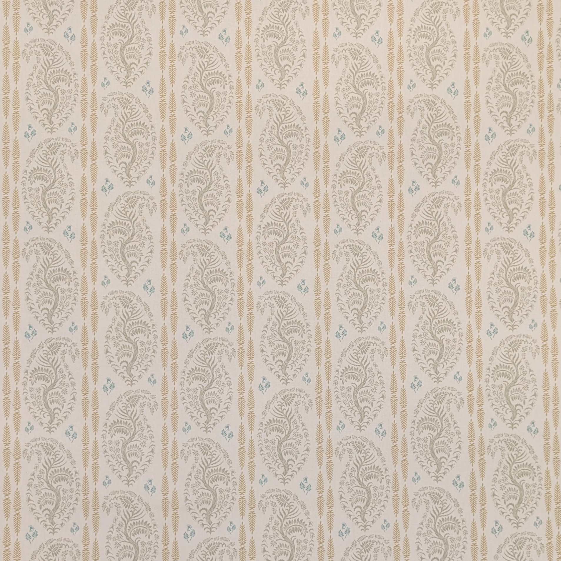 Patterned fabric with decorative design on a beige background