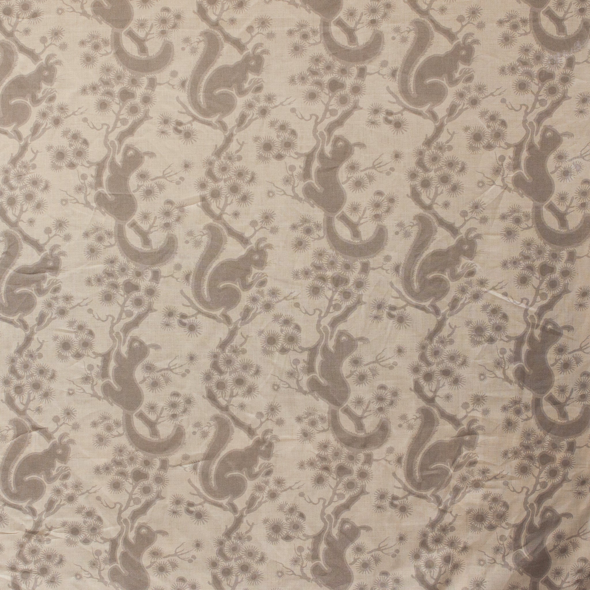 Pattern of squirrels and branches on a beige background
