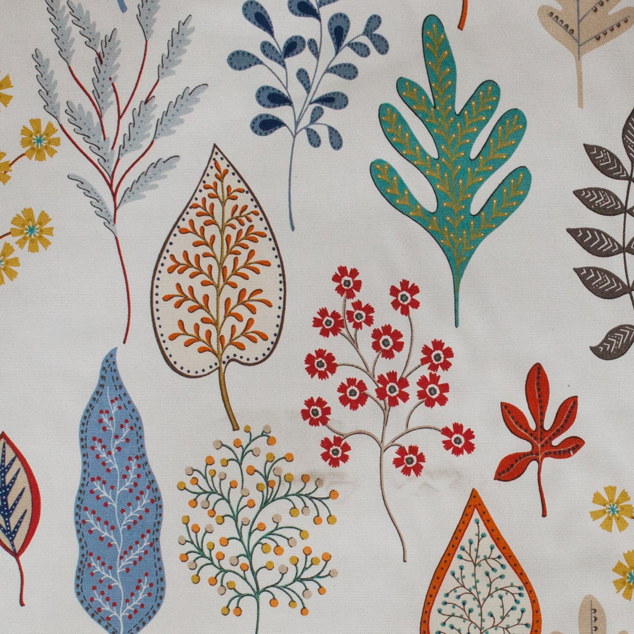 Multi coloured leaf design on white fabric background