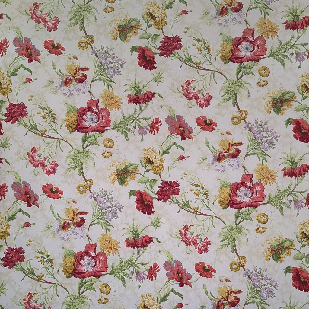 Floral patterned fabric with red, yellow, and green flowers on a light background