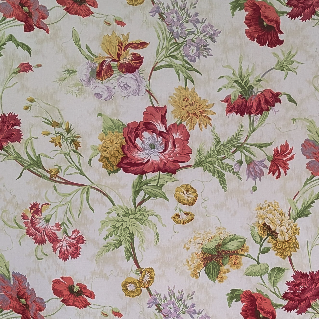 Floral patterned fabric with red, yellow, and green flowers on a light background