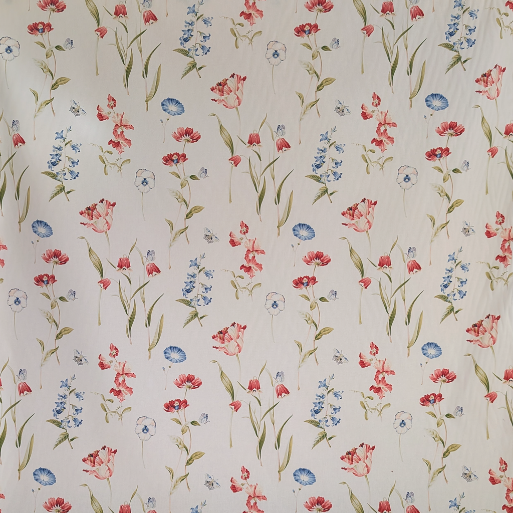 Floral patterned fabric with red, pink, and blue flowers on a beige background