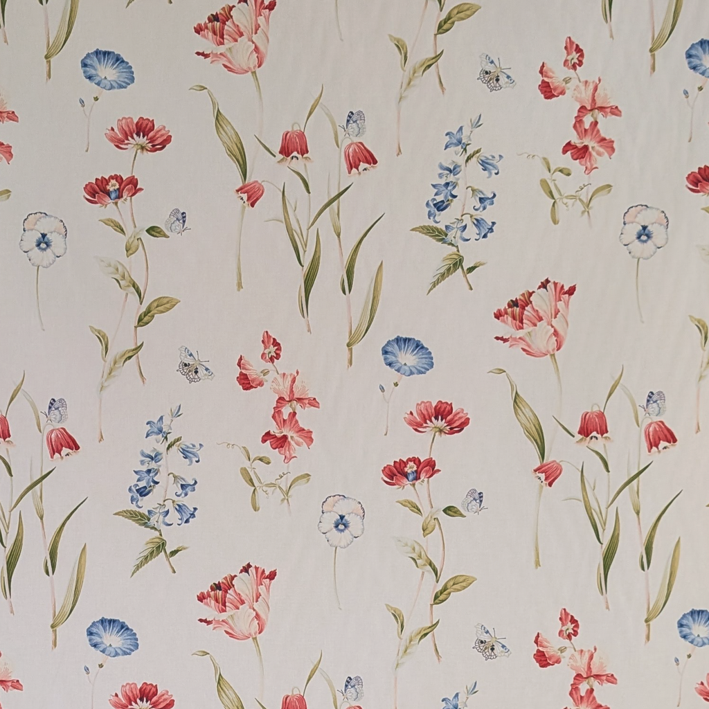 Floral pattern with red, blue, and pink flowers on a light background