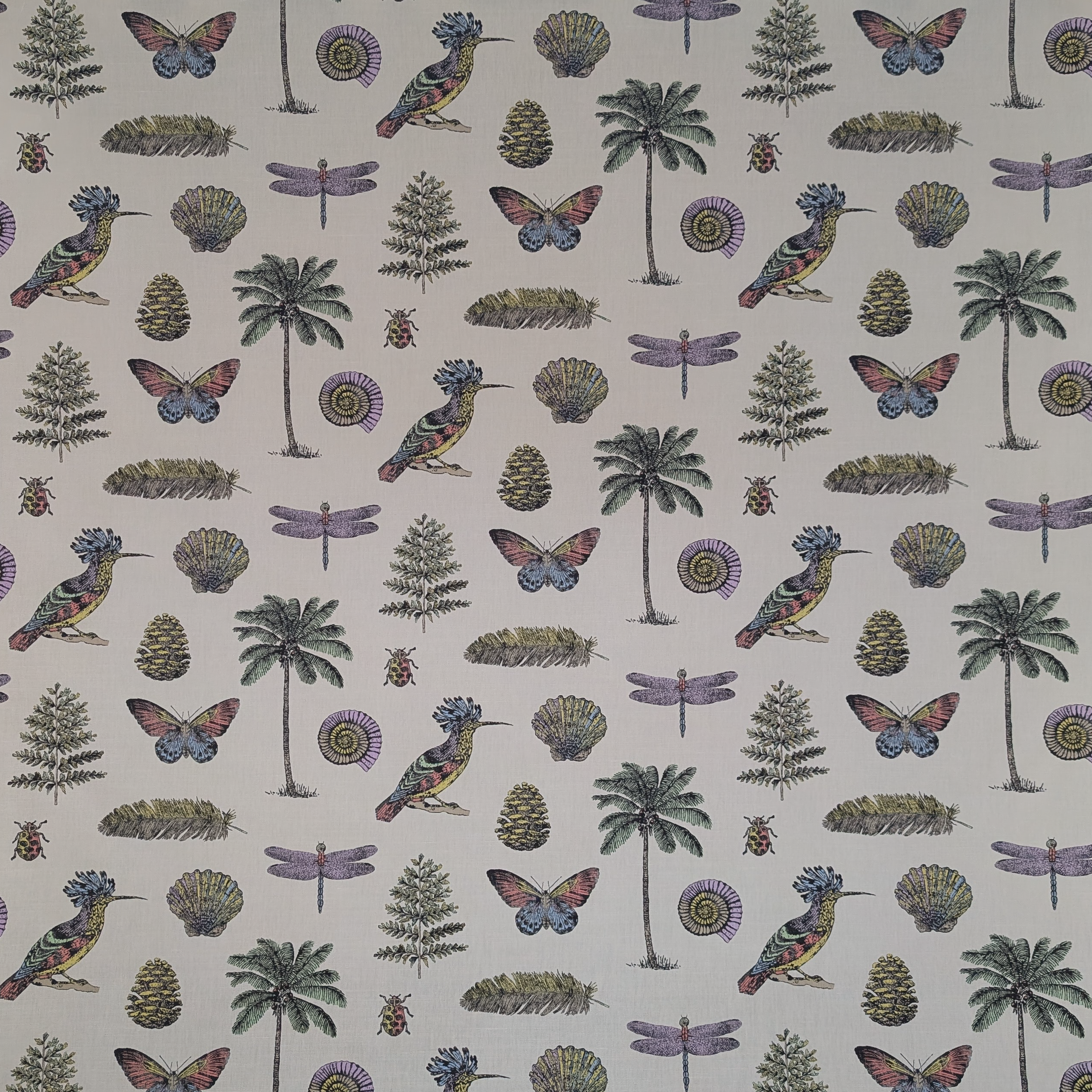 Patterned fabric with birds, butterflies, trees, and plants on a beige background