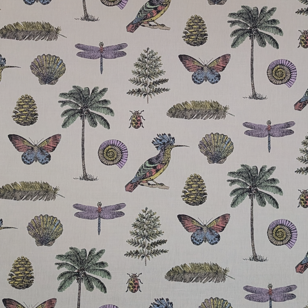 Patterned fabric with tropical elements including palm trees, butterflies, and dragonflies on a beige background.