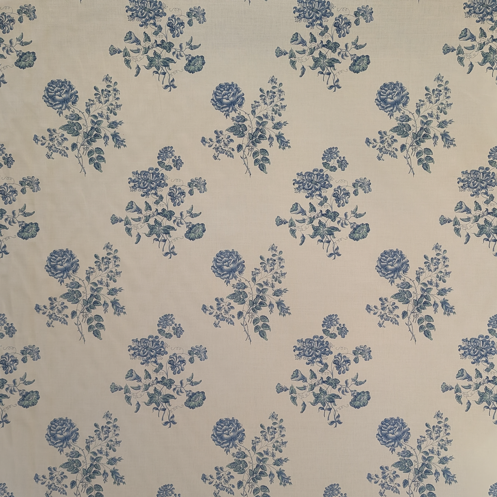 Pattern of blue flowers on a beige background