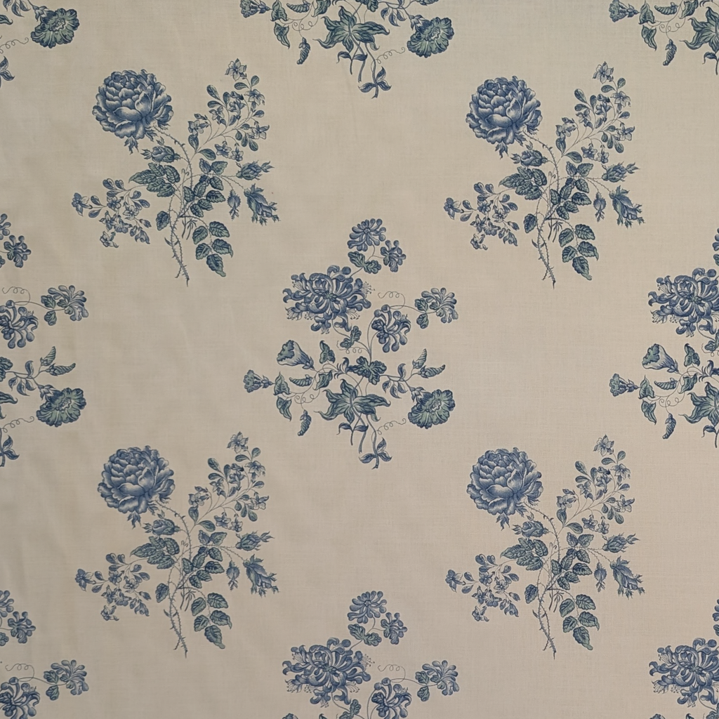 Pattern of blue flowers on a beige background
