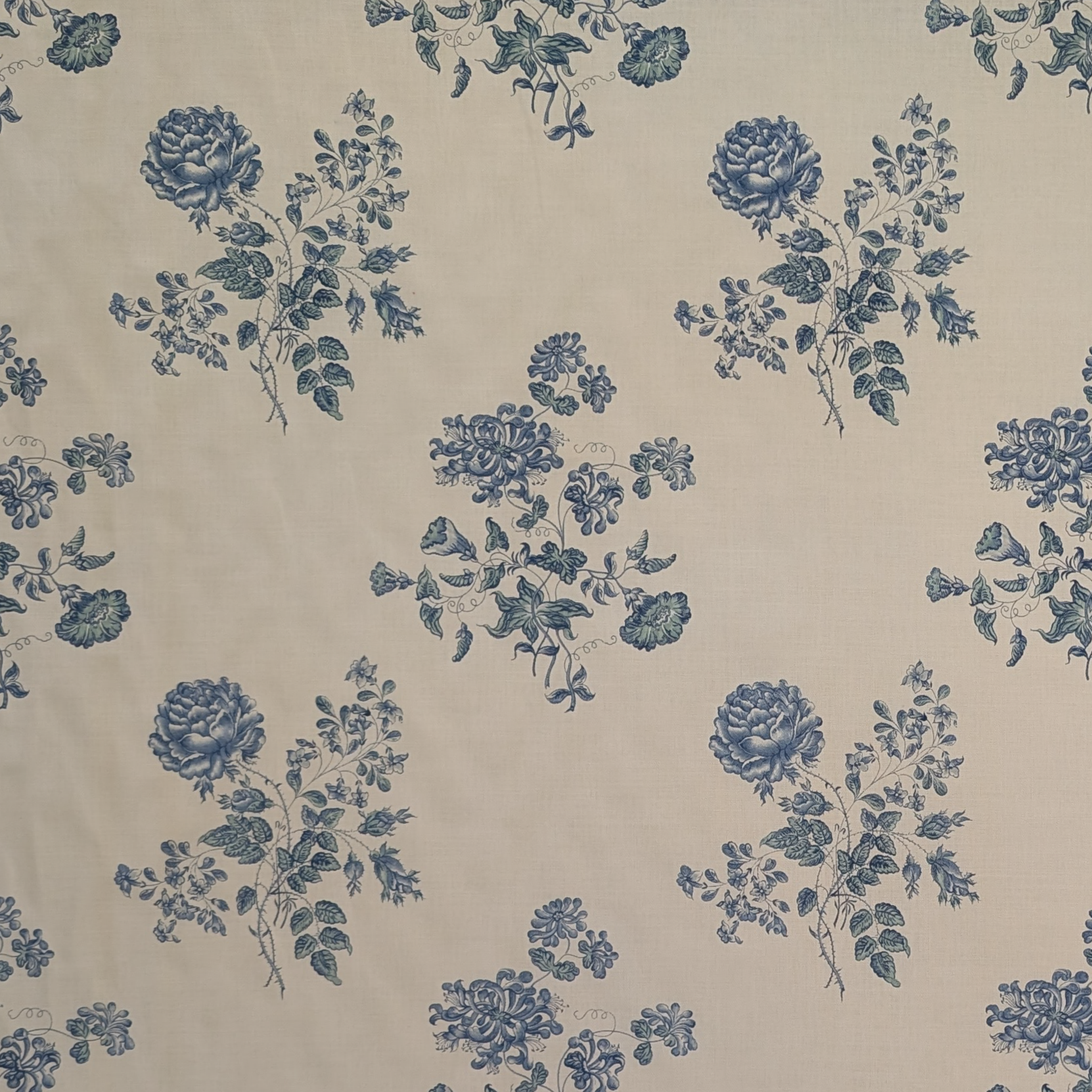 Pattern of blue flowers on a beige background