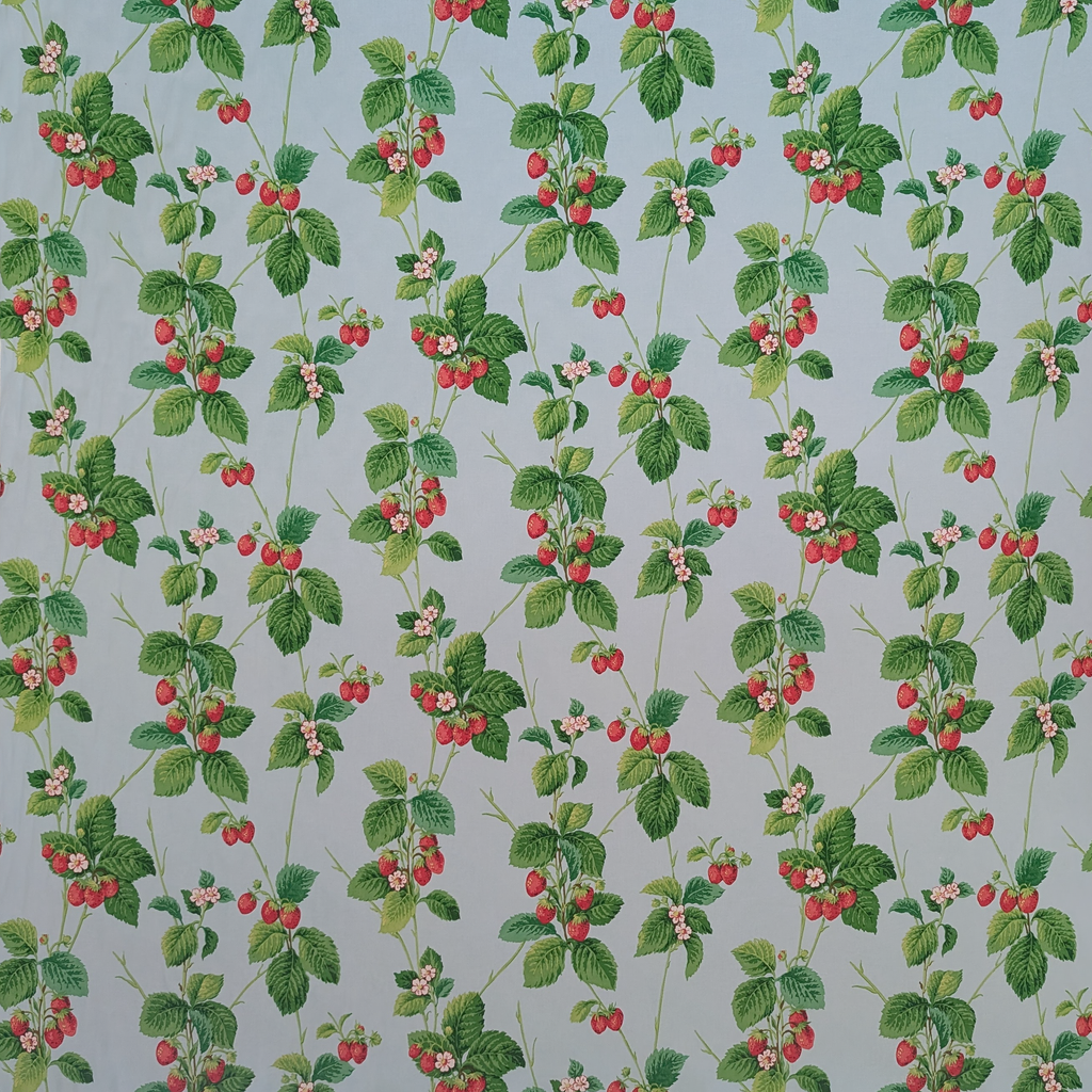 Pattern of strawberries and green leaves on a blue background