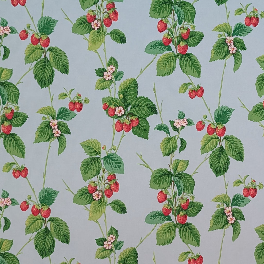 Pattern of strawberries and green leaves on a blue background